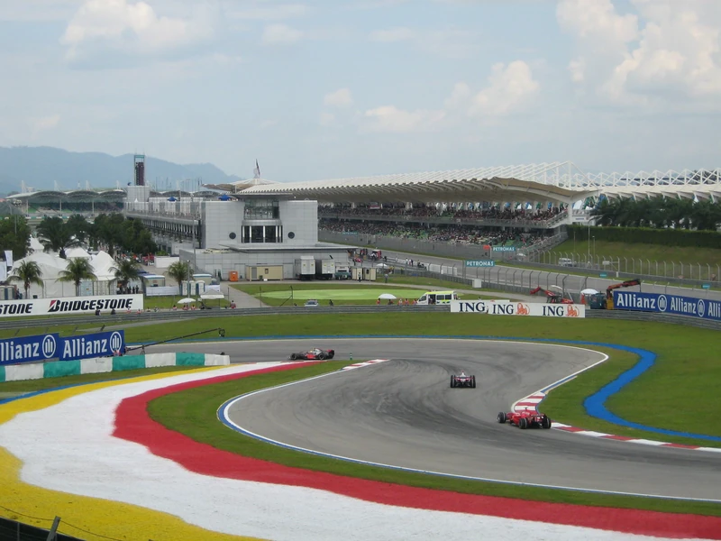 Formula One cars racing during qualifying at Sepang International Circuit in Malaysia